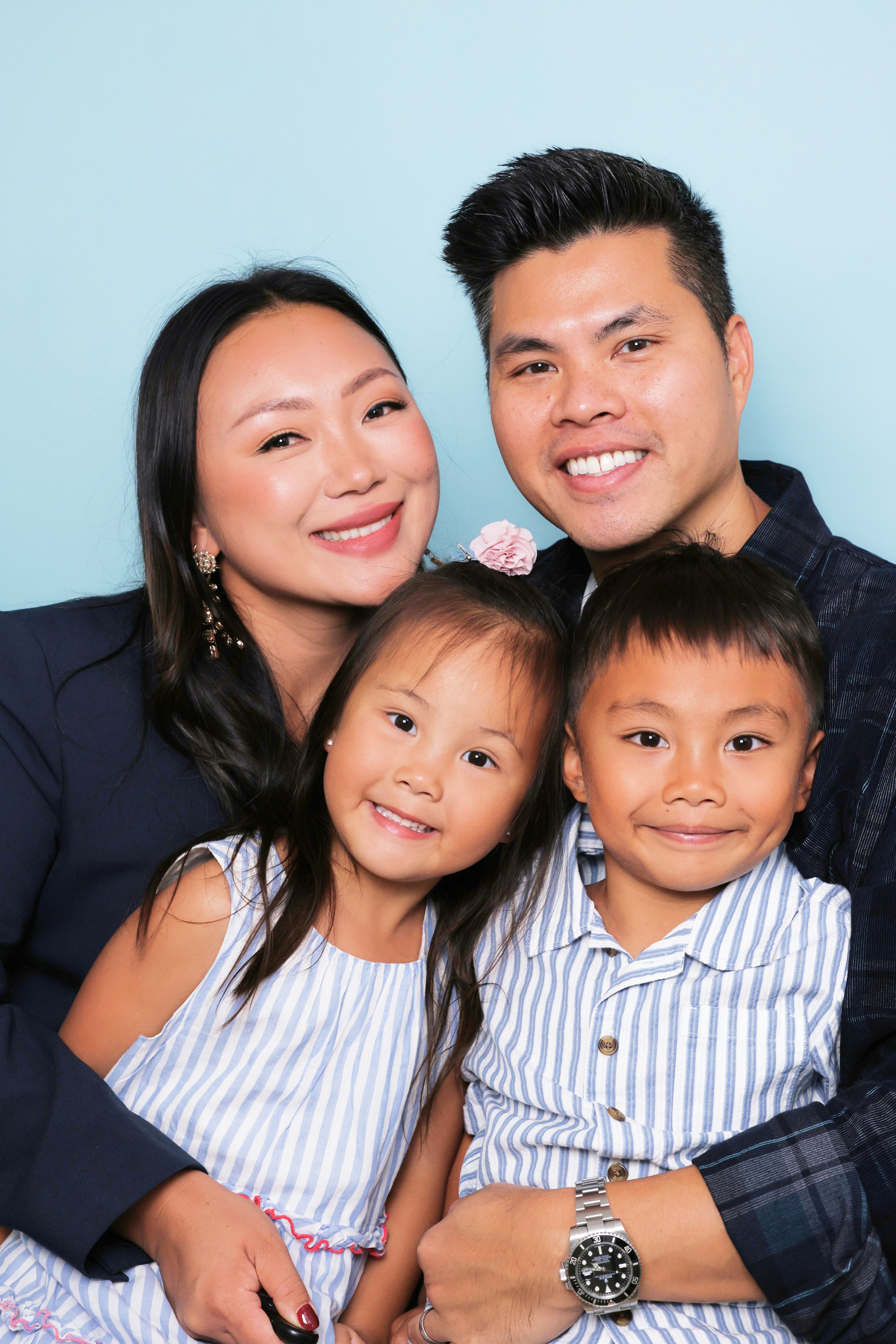 Cute family self-capture photography with husband, wife and two kids; Family portrait photography